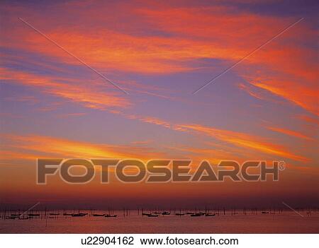 Vivid sunrise over harbour View Large Photo Image Stock Image - Vivid sunrise over harbour. Fotosearch