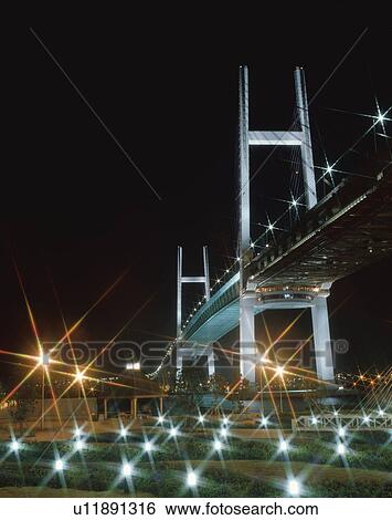 Stock Photograph - Yokohama Bay Bridge illuminated at night, Yokohama, Kanagawa Prefecture, Japan. Fotosearch