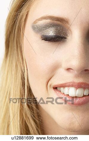 Stock Photo - Close Up Of Young Woman Wearing Make Up. Fotosearch