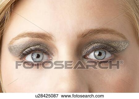 Stock Photo - Close Up Of Young Woman Wearing Make Up. Fotosearch