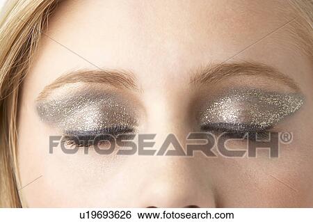 Stock Photograph - Close Up Of Young Woman Wearing Make Up. Fotosearch