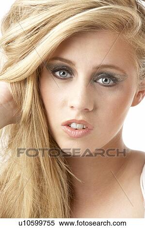 Stock Photography - Close Up Of Young Woman Wearing Make Up. Fotosearch