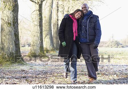 Couple On Autumn Walk View Large Photo Image Stock Photo - Couple On Autumn Walk. Fotosearch