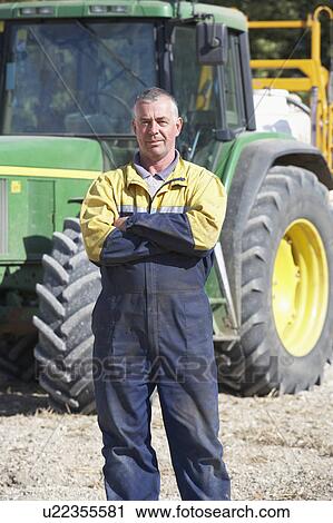 Driver Standing In Front Of Tractor View Large Photo Image Stock Image - Driver Standing In Front Of Tractor. Fotosearch