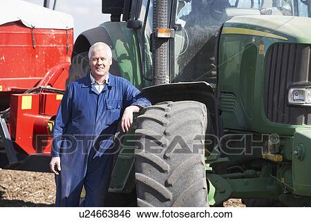 Driver Standing In Front Of Tractor View Large Photo Image Stock Photograph - Driver Standing In Front Of Tractor. Fotosearch