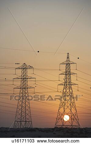 Electricity Pylons Silhouetted At Sunset View Large Photo Image Stock Image - Electricity Pylons Silhouetted At Sunset. Fotosearch