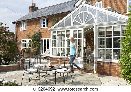 Exterior Of House With Conservatory And Patio View Large Photo Image Stock Image - Exterior Of House With Conservatory And Patio. Fotosearch