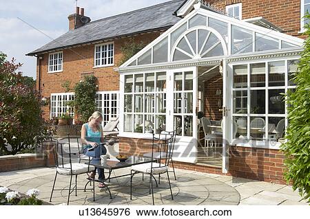 Exterior Of House With Conservatory And Patio View Large Photo Image Stock Photograph - Exterior Of House With Conservatory And Patio. Fotosearch