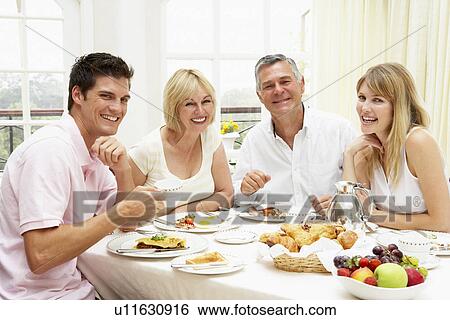 Family Group Enjoying Hotel Breakfast View Large Photo Image Stock Photograph - Family Group Enjoying Hotel Breakfast. Fotosearch