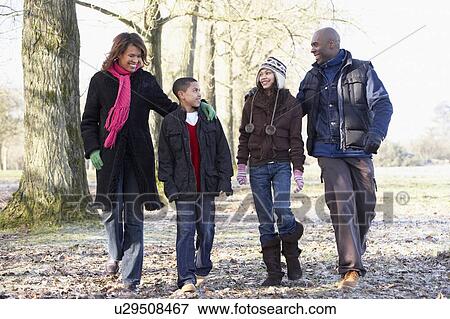 Stock Photo - Family On Autumn Walk In Countryside. Fotosearch