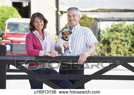 Farmer And Wife Looking Over Farm Gate View Large Photo Image Stock Photograph - Farmer And Wife Looking Over Farm Gate. Fotosearch