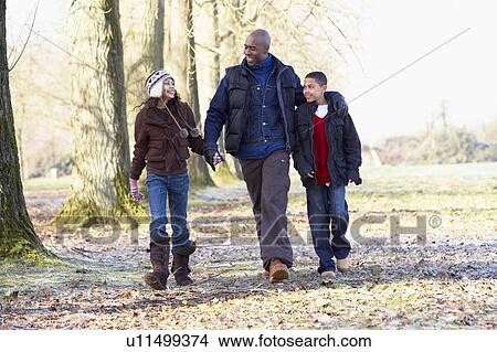 Picture - Father And Children On Autumn Walk. Fotosearch