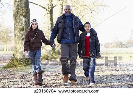 Picture - Father And Children On Autumn Walk. Fotosearch