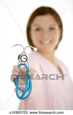 Stock Image - Female Doctor Holding Stethescope. Fotosearch