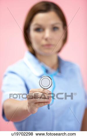 Female Doctor Holding Stethescope View Large Photo Image Stock Photo - Female Doctor Holding Stethescope. Fotosearch