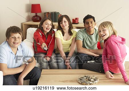 Stock Photo - Group Of Children Watching TV At Home. Fotosearch