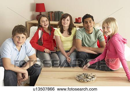 Stock Photograph - Group Of Children Watching TV At Home. Fotosearch