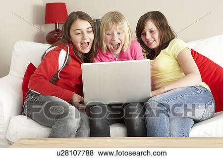 Group Of Three Girls Using Laptop At Home View Large Photo Image Stock Photo - Group Of Three Girls Using Laptop At Home. Fotosearch