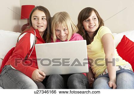Group Of Three Girls Using Laptop At Home View Large Photo Image Stock Photograph - Group Of Three Girls Using Laptop At Home. Fotosearch