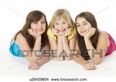 Group Of Three Young Girls In Studio View Large Photo Image Picture - Group Of Three Young Girls In Studio. Fotosearch