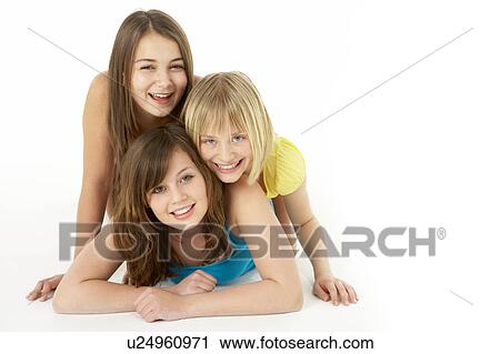 Stock Image - Group Of Three Young Girls In Studio. Fotosearch