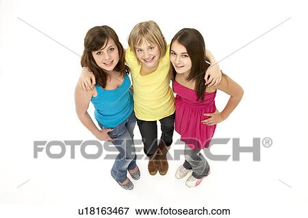 Stock Photo - Group Of Three Young Girls In Studio. Fotosearch