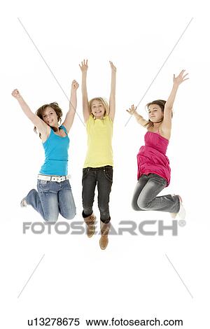 Stock Photography - Group Of Three Young Girls Leaping In Air. Fotosearch