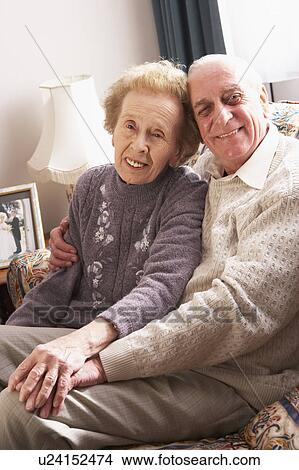 Loving Senior Couple Relaxing At Home View Large Photo Image Picture - Loving Senior Couple Relaxing At Home. Fotosearch