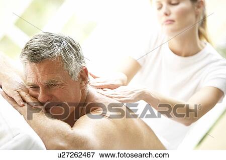 Middle Aged Man Enjoying Massage View Large Photo Image Stock Photo - Middle Aged Man Enjoying Massage. Fotosearch