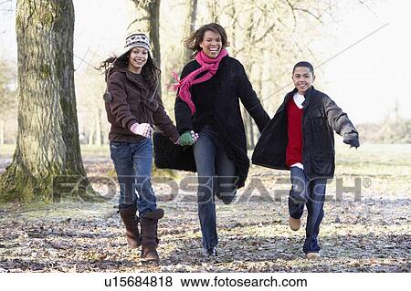 Mother And Children On Autumn Walk View Large Photo Image Stock Photo - Mother And Children On Autumn Walk. Fotosearch