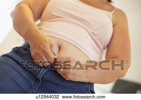 Overweight Woman Trying To Fasten Trousers View Large Photo Image Stock Image - Overweight Woman Trying To Fasten Trousers. Fotosearch