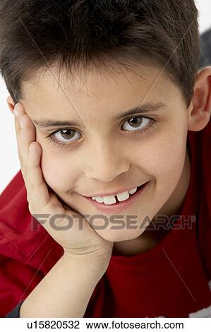 Stock Image - Portrait Of Smiling Young boy. Fotosearch