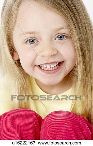 Portrait Of Smiling Young Girl View Large Photo Image Stock Photo - Portrait Of Smiling Young Girl. Fotosearch