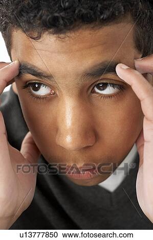 Stock Image - Portrait Of Stressed Young Boy. Fotosearch