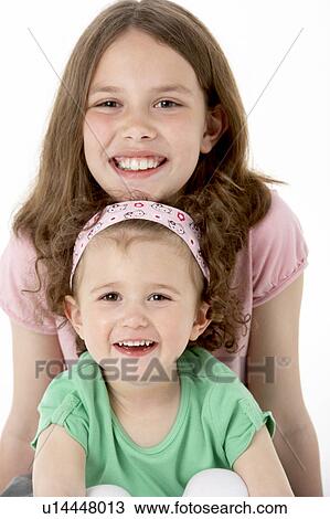Portrait Of Two Young Girls View Large Photo Image Stock Image - Portrait Of Two Young Girls. Fotosearch