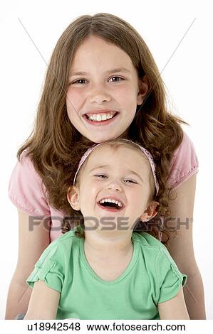 Stock Photo - Portrait Of Two Young Girls. Fotosearch