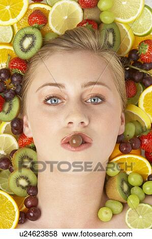 Portrait Of Young Woman Eating Chocolate View Large Photo Image Stock Photo - Portrait Of Young Woman Eating Chocolate. Fotosearch