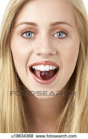 Portrait Of Young Woman Eating Grape View Large Photo Image Stock Photo - Portrait Of Young Woman Eating Grape. Fotosearch