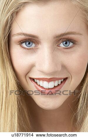 Picture - Portrait Of Young Woman Looking At Camera. Fotosearch