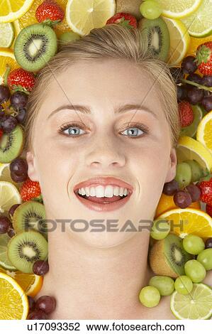 Portrait Of Young Woman Surrounded By Fruit View Large Photo Image Stock Image - Portrait Of Young Woman Surrounded By Fruit. Fotosearch