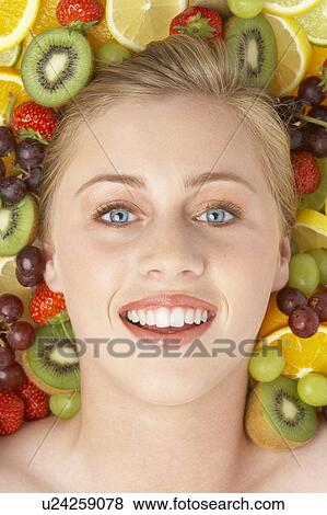 Portrait Of Young Woman Surrounded By Fruit View Large Photo Image Stock Photo - Portrait Of Young Woman Surrounded By Fruit. Fotosearch
