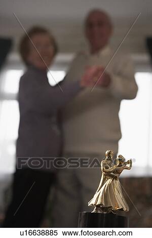 Stock Photography - Senior Couple With Dance Trophy. Fotosearch