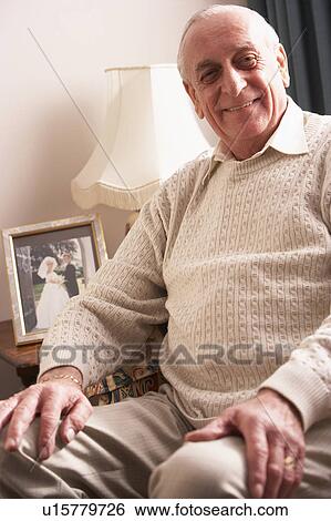 Stock Photograph - Senior Man Relaxing At Home. Fotosearch