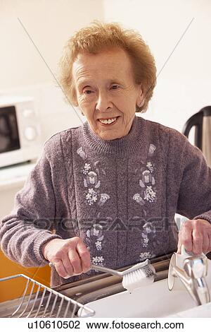 Senior Woman Washing Up At Sink View Large Photo Image Stock Image - Senior Woman Washing Up At Sink. Fotosearch