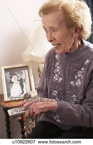 Senior Woman Watching TV At Home View Large Photo Image Stock Photo - Senior Woman Watching TV At Home. Fotosearch
