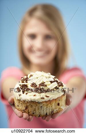 Picture - Teenage Girl Holding Cream Cake. Fotosearch
