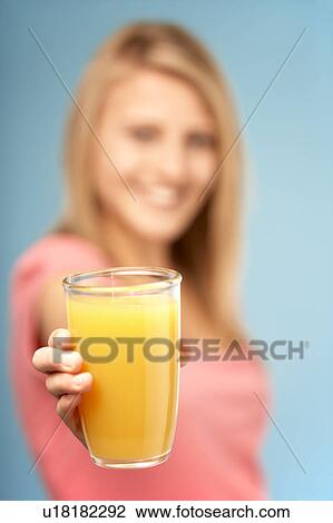 Teenage Girl Holding Glass Of Juice View Large Photo Image Stock Image - Teenage Girl Holding Glass Of Juice. Fotosearch