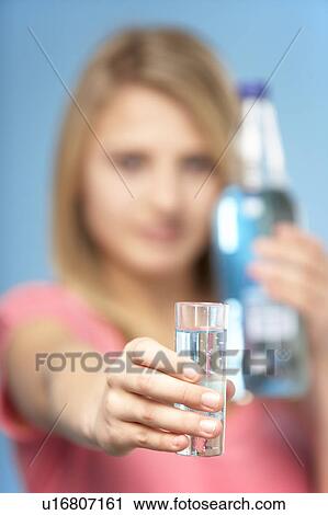 Teenage Girl Holding Glass Of Spirits View Large Photo Image Stock Image - Teenage Girl Holding Glass Of Spirits. Fotosearch