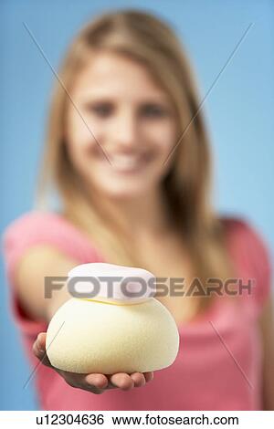 Stock Photograph - Teenage Girl Holding Soap And Sponge. Fotosearch