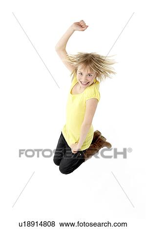 Stock Photo - Teenage Girl Leaping In Studio. Fotosearch